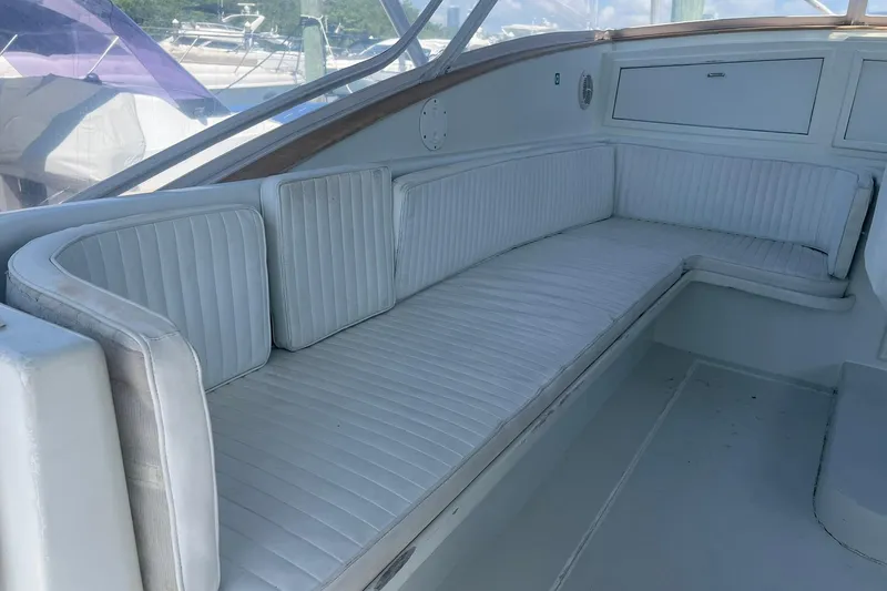  Yacht Photos Pics 1993 Buddy Davis 38 Express boat interior with white cushioned seating.