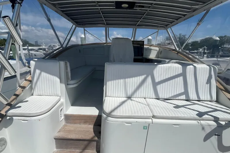  Yacht Photos Pics 1993 Buddy Davis 38 Express boat interior with white seating and canopy.