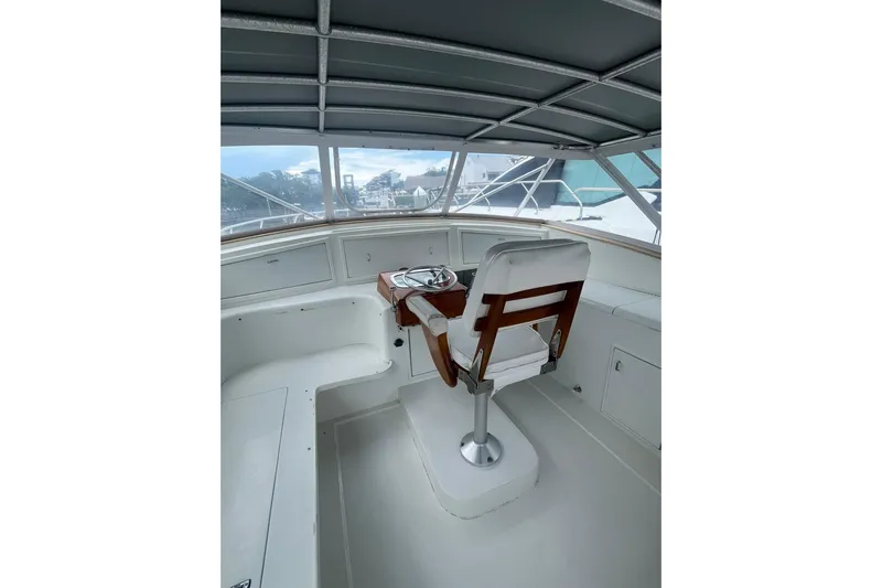  Yacht Photos Pics Helm of 1993 Buddy Davis 38 Express boat with white seating and steering wheel.