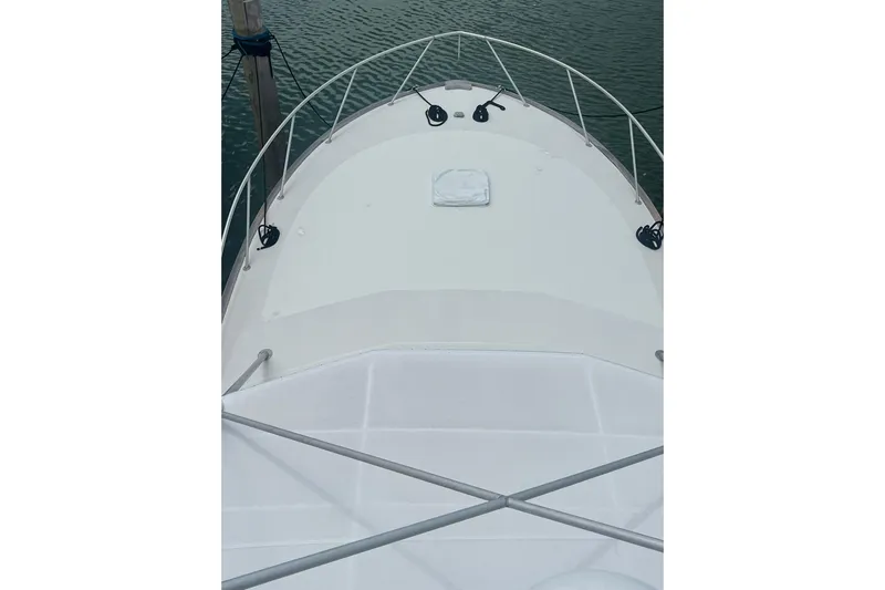  Yacht Photos Pics Bow view of 1993 Buddy Davis 38 Express boat on water.