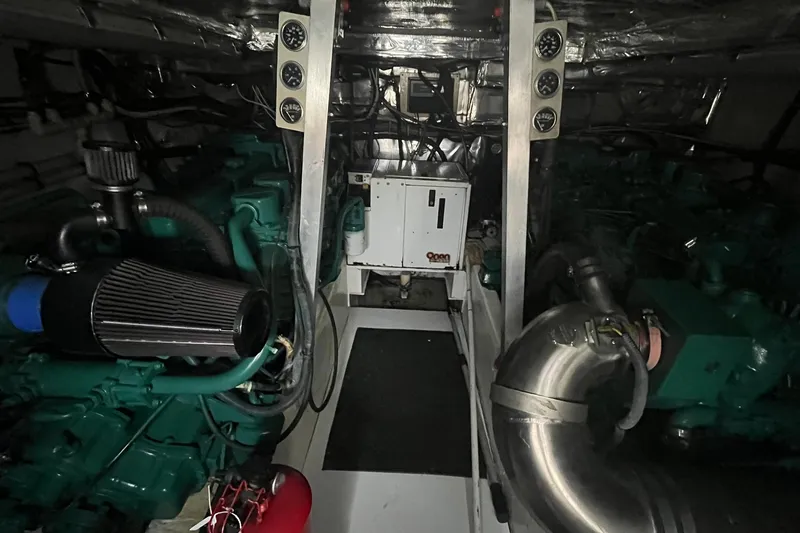  Yacht Photos Pics Engine room of 1993 Buddy Davis 38 Express, showcasing mechanical components and gauges.
