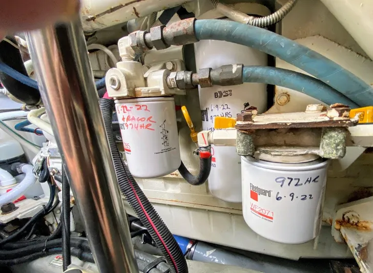  Yacht Photos Pics Engine compartment of a 2001 Sea Ray 460 Sundancer with visible fuel filters and hoses.