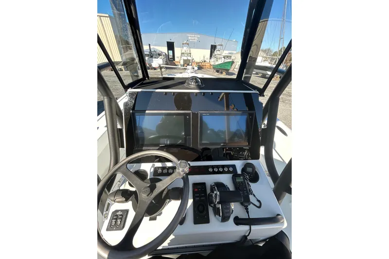  Yacht Photos Pics Cockpit of 2017 Baker Boatworks 26 Open with modern navigation equipment and steering wheel.