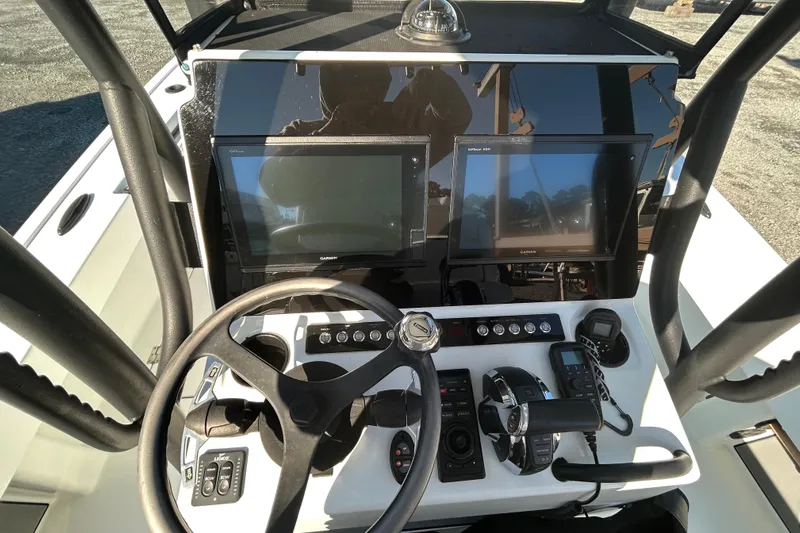  Yacht Photos Pics 2017 Baker Boatworks 26 Open dashboard with steering wheel, controls, and navigation screens.