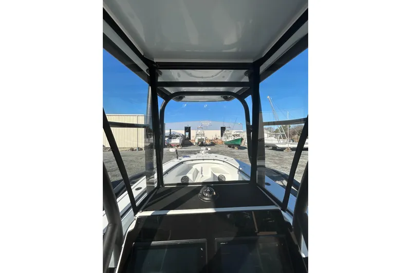  Yacht Photos Pics Interior view of 2017 Baker Boatworks 26 Open, showcasing helm and windshield.