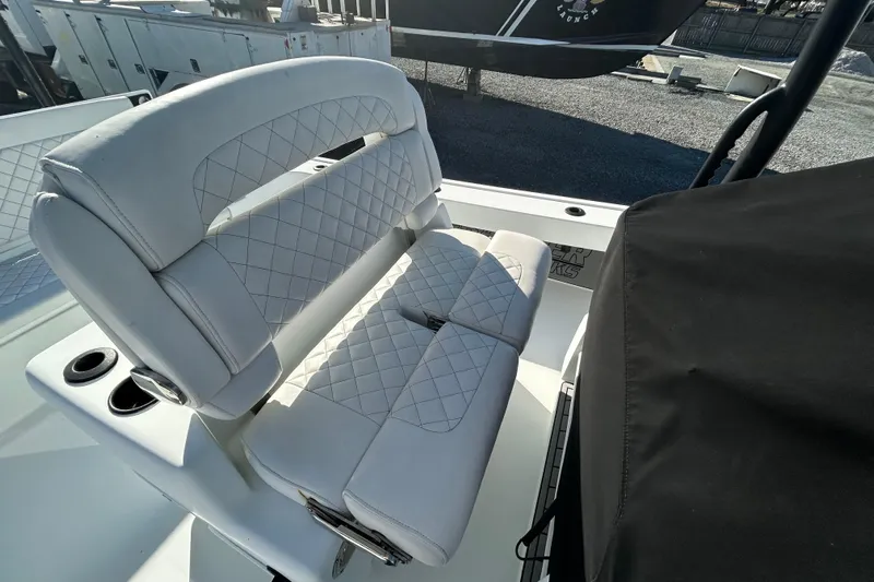  Yacht Photos Pics 2017 Baker Boatworks 26 Open with white quilted seating and cup holders.