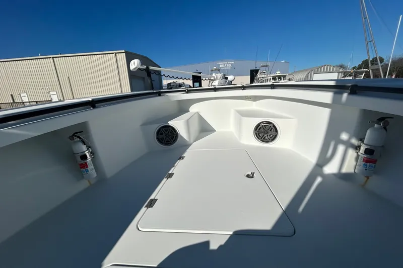 Yacht Photos Pics 2017 Baker Boatworks 26 Open deck with fire extinguishers and storage compartments.