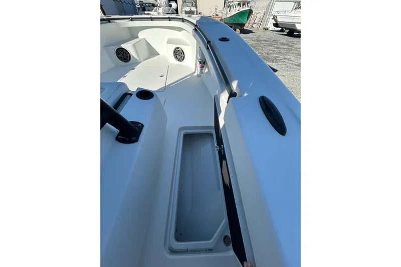  Yacht Photos Pics 2017 Baker Boatworks 26 Open deck view with storage compartment and speakers.