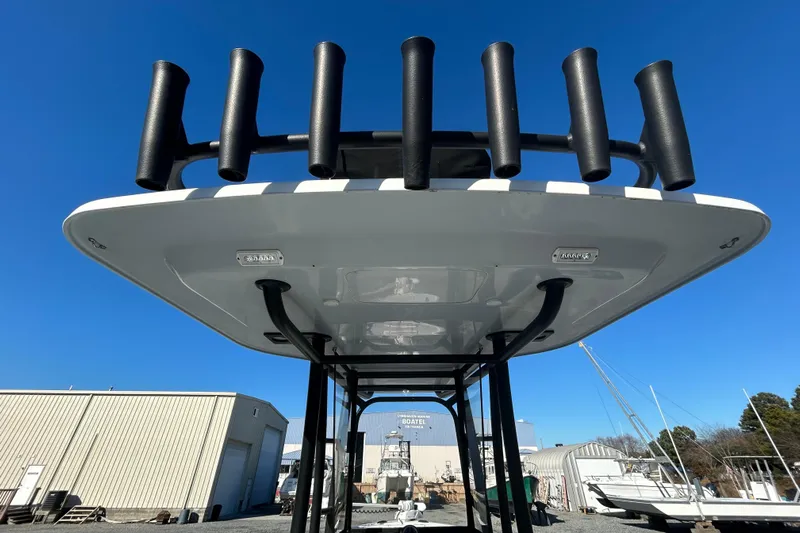  Yacht Photos Pics 2017 Baker Boatworks 26 Open with rod holders, viewed from below against a clear blue sky.