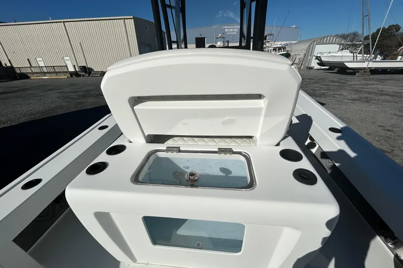  Yacht Photos Pics 2017 Baker Boatworks 26 Open with open storage compartment, docked at a marina.