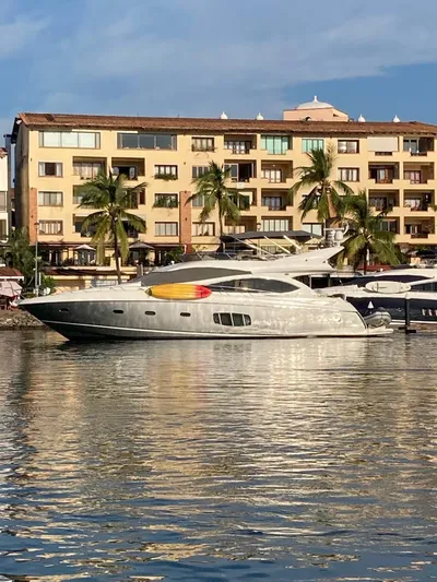 La Chaparrita Yacht Photos Pics 2011 Sunseeker Manhattan 70 yacht docked near waterfront apartments.