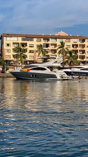 La Chaparrita Yacht Photos Pics 2011 Sunseeker Manhattan 70 yacht docked near waterfront apartments.