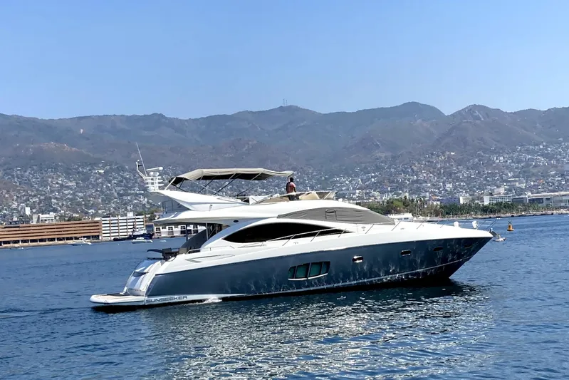 La Chaparrita Yacht Photos Pics 2011 Sunseeker Manhattan 70 yacht cruising on a scenic coastal waterway.