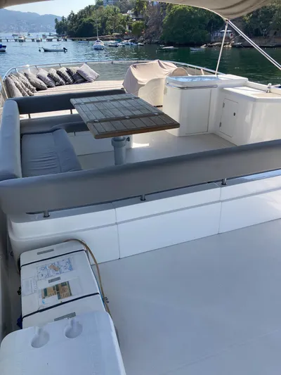 La Chaparrita Yacht Photos Pics 2011 Sunseeker Manhattan 70 yacht with spacious outdoor seating and dining area.