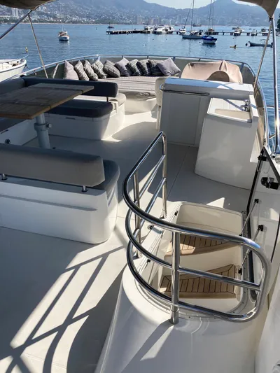 La Chaparrita Yacht Photos Pics Upper deck of a 2011 Sunseeker Manhattan 70 yacht with seating and scenic views.