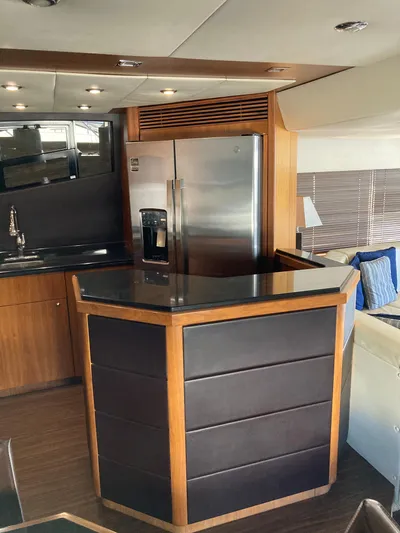 La Chaparrita Yacht Photos Pics Modern kitchen area in a 2011 Sunseeker Manhattan 70 yacht with stainless steel appliances.