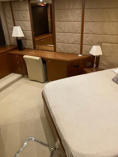 La Chaparrita Yacht Photos Pics Luxurious bedroom interior of 2011 Sunseeker Manhattan 70 yacht with wooden desk and lamps.