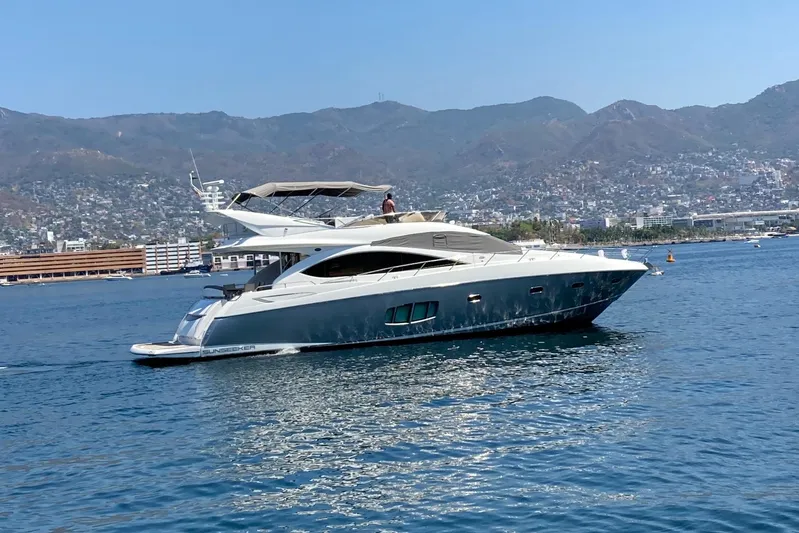 La Chaparrita Yacht Photos Pics 2011 Sunseeker Manhattan 70 yacht cruising on a scenic coastal waterway.