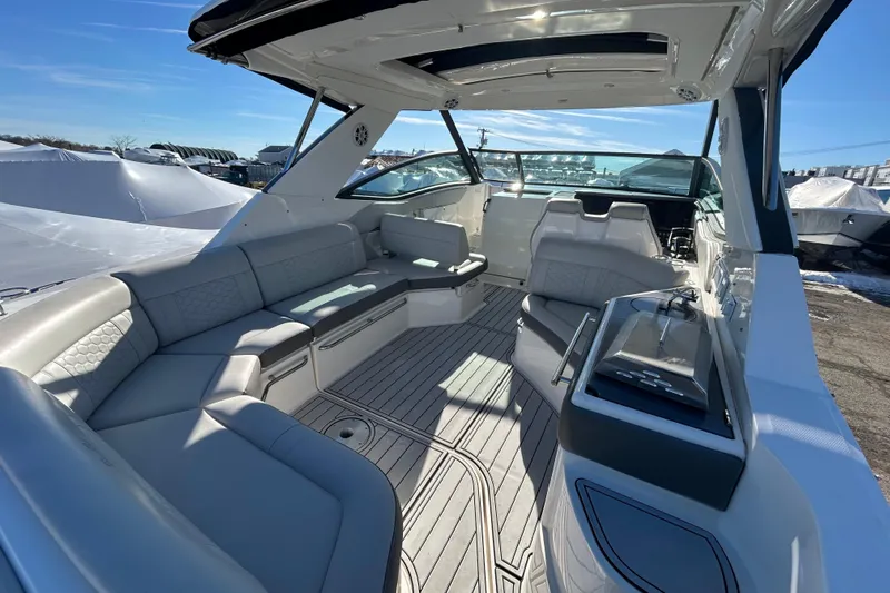  Yacht Photos Pics 2021 Sea Ray Sundancer 320 interior with sleek seating and modern design.