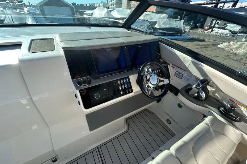  Yacht Photos Pics 2021 Sea Ray Sundancer 320 helm with modern controls and sleek design.