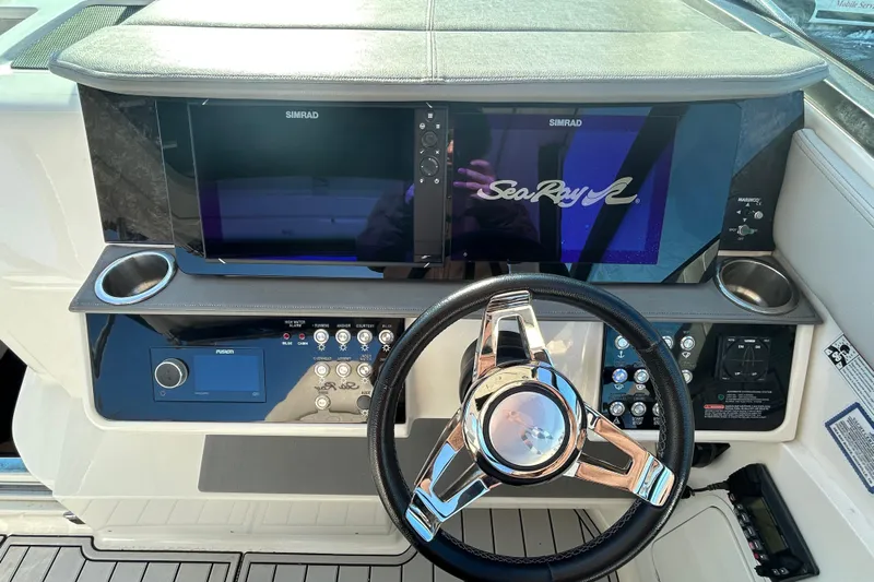  Yacht Photos Pics 2021 Sea Ray Sundancer 320 helm with Simrad displays and modern controls.