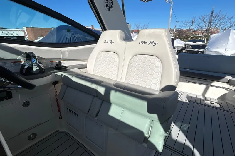  Yacht Photos Pics 2021 Sea Ray Sundancer 320 cockpit with dual helm seats and modern controls.
