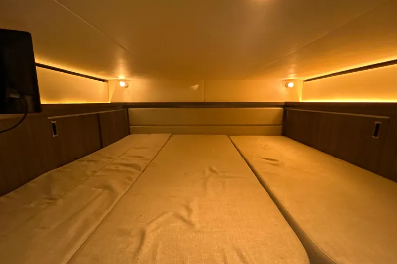  Yacht Photos Pics 2021 Sea Ray Sundancer 320 cabin interior with cozy lighting and comfortable seating.