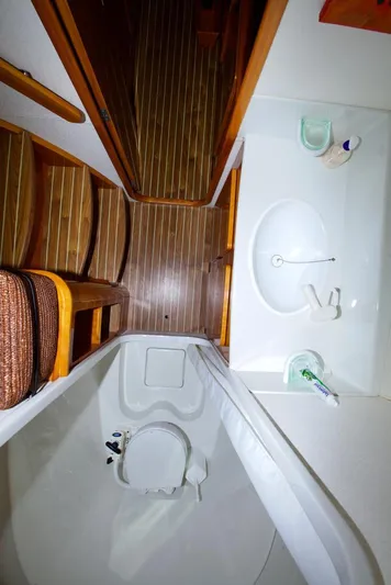 Osina Yacht Photos Pics Bathroom interior of 2000 Privilege 37 yacht with wooden flooring and compact amenities.