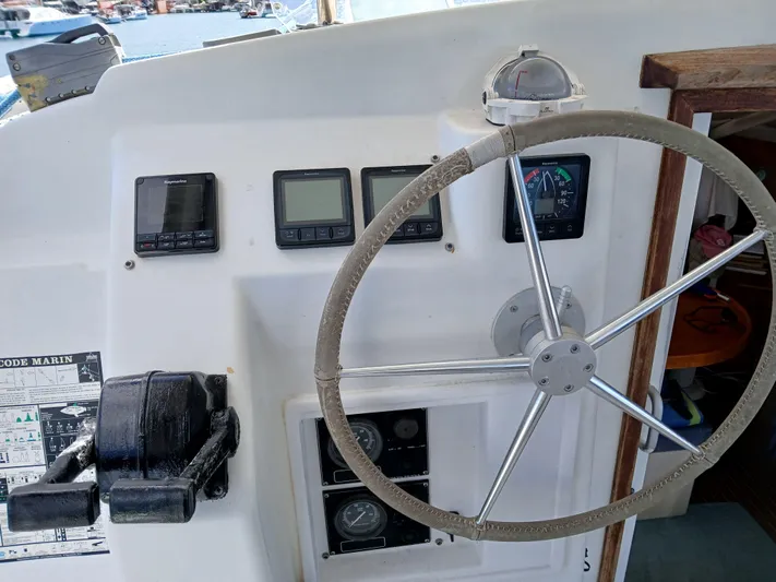 Osina Yacht Photos Pics Steering wheel and navigation instruments on a 2000 Privilege 37 yacht.