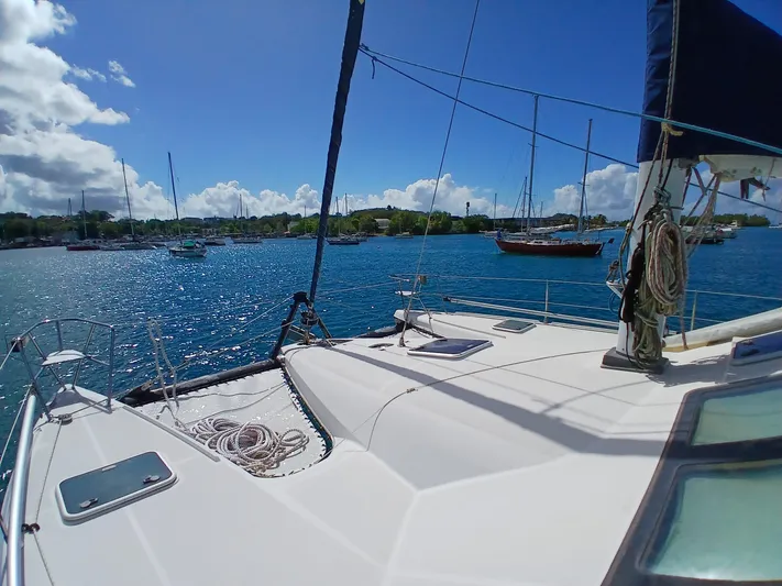 Osina Yacht Photos Pics Sailing yacht Privilege 37, 2000 model, anchored in a sunny, scenic harbor.