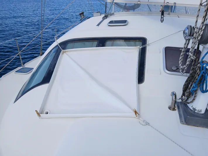 Osina Yacht Photos Pics Deck of 2000 Privilege 37 yacht with sunshade and ocean view.