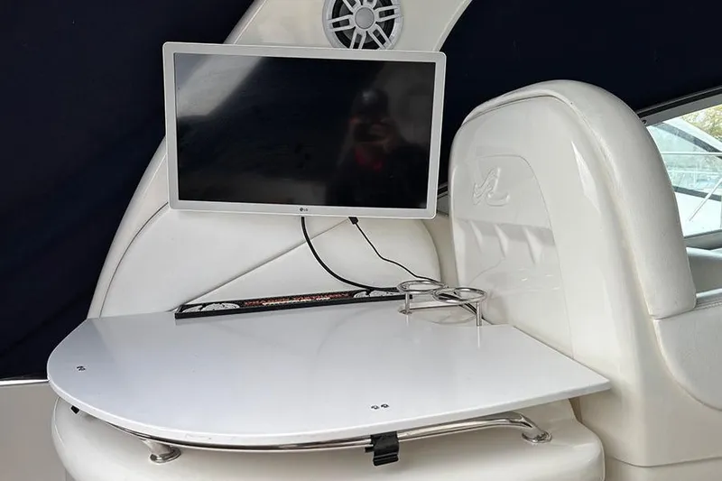  Yacht Photos Pics Interior of 2005 Sea Ray 340 Sundancer with TV and table setup.