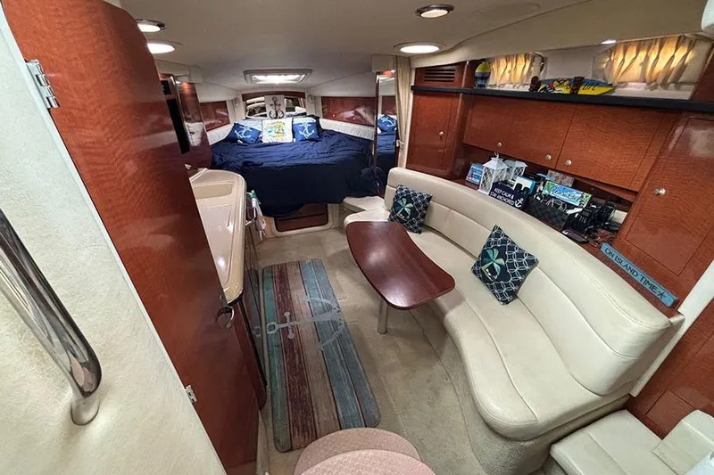  Yacht Photos Pics Interior of 2005 Sea Ray 340 Sundancer yacht with cozy seating and elegant wood finishes.