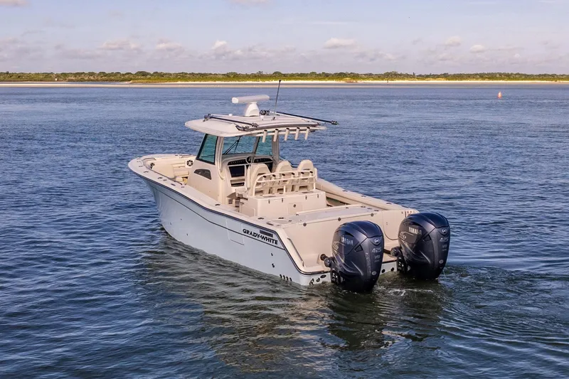  Yacht Photos Pics 2022 Grady-White Canyon 336 boat on open water, featuring dual outboard engines.