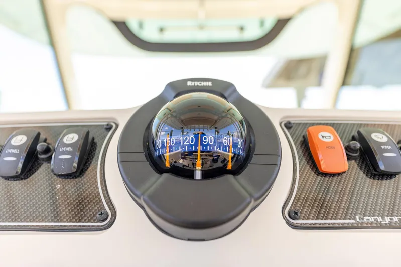  Yacht Photos Pics Compass on 2022 Grady-White Canyon 336 boat dashboard, featuring navigation controls.