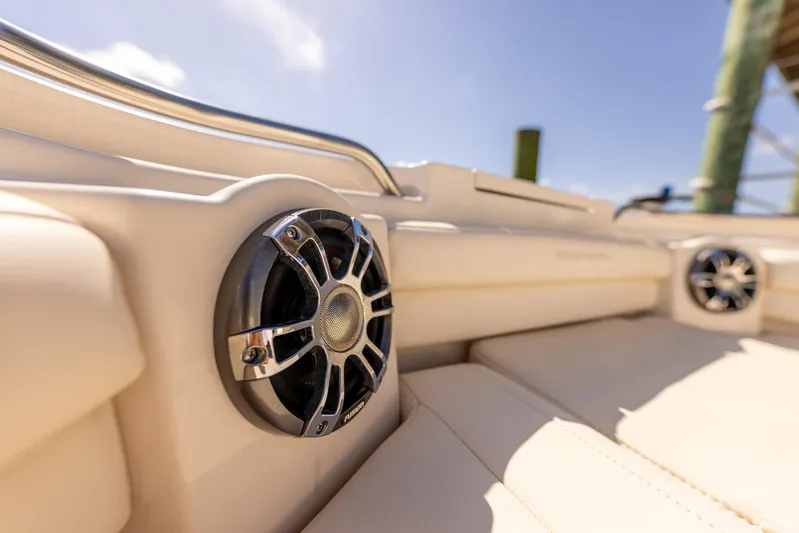  Yacht Photos Pics 2022 Grady-White Canyon 336 boat interior with speakers and cushioned seating.