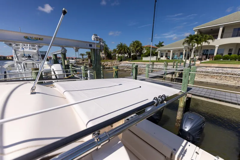  Yacht Photos Pics 2022 Grady-White Canyon 336 docked at a sunny marina with palm trees.