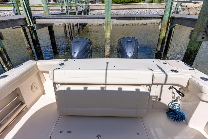  Yacht Photos Pics 2022 Grady-White Canyon 336 boat with dual outboard engines at dock.