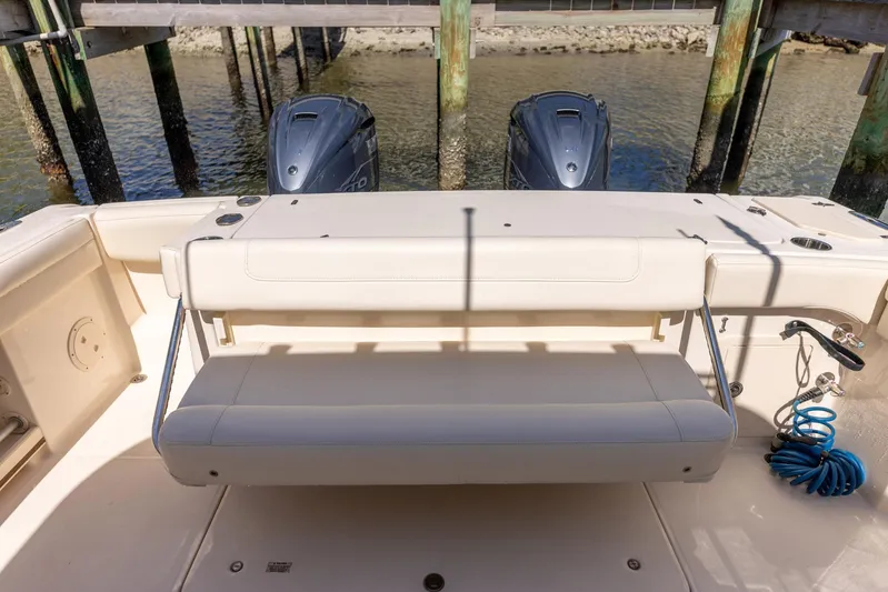 Yacht Photos Pics 2022 Grady-White Canyon 336 boat with dual engines and seating at dock.