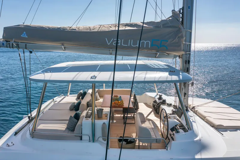  Yacht Photos Pics Luxurious 2023 Lagoon 55 yacht with spacious deck and elegant seating area.