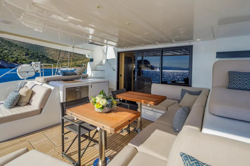  Yacht Photos Pics Luxurious 2023 Lagoon 55 yacht interior with elegant seating and ocean view.