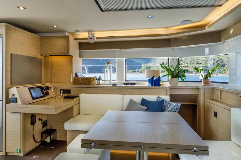  Yacht Photos Pics Luxurious interior of 2023 Lagoon 55 yacht with modern design and scenic views.