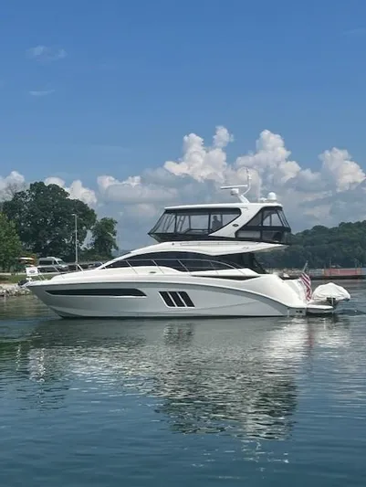 Yonder Star Yacht Photos Pics 2016 Sea Ray 510 Fly yacht on calm water under a clear blue sky.