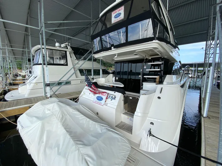 Yonder Star Yacht Photos Pics 2016 Sea Ray 510 Fly yacht for sale, docked under a covered marina.