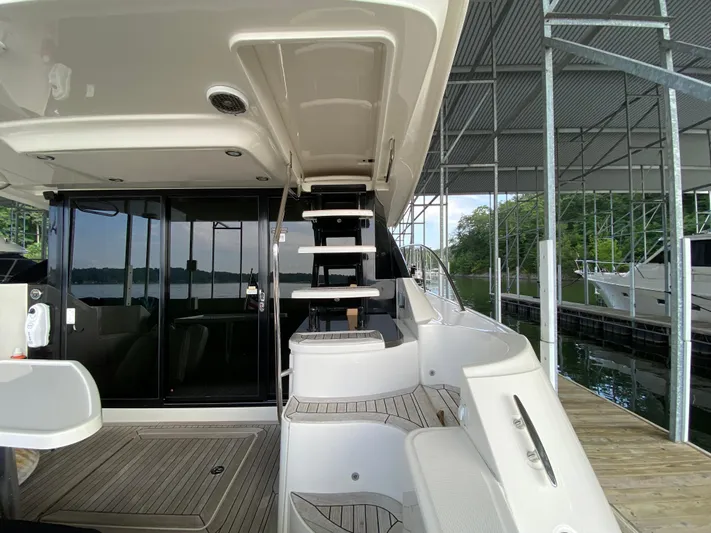 Yonder Star Yacht Photos Pics 2016 Sea Ray 510 Fly yacht interior with stairs and dock view.