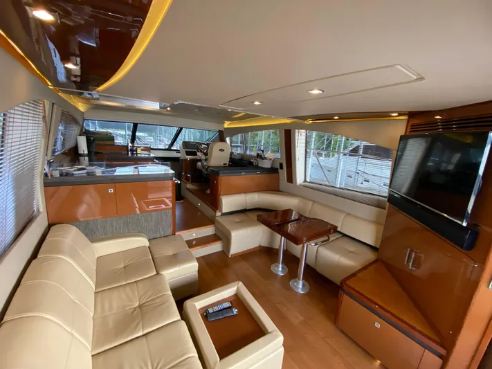 Yonder Star Yacht Photos Pics Luxurious interior of 2016 Sea Ray 510 Fly yacht with modern furnishings and sleek design.