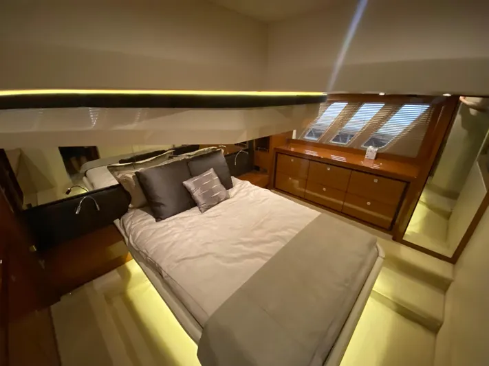 Yonder Star Yacht Photos Pics Luxurious bedroom interior of 2016 Sea Ray 510 Fly yacht with modern design and ambient lighting.