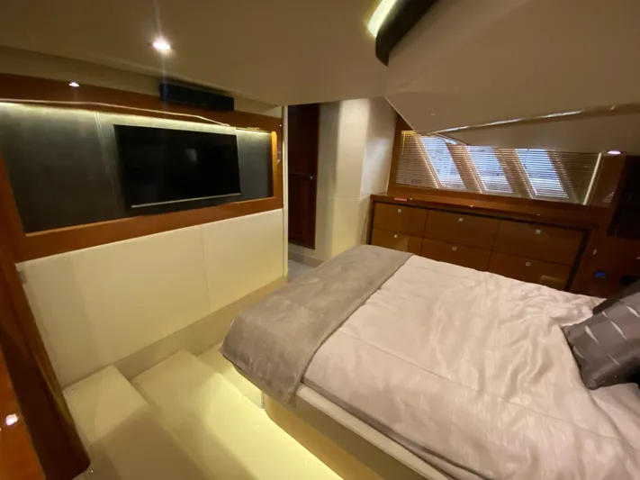 Yonder Star Yacht Photos Pics Luxurious interior of 2016 Sea Ray 510 Fly yacht with bed and TV.