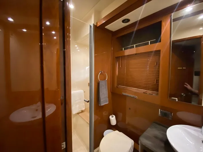 Yonder Star Yacht Photos Pics Luxurious bathroom interior of 2016 Sea Ray 510 Fly yacht with wooden accents.