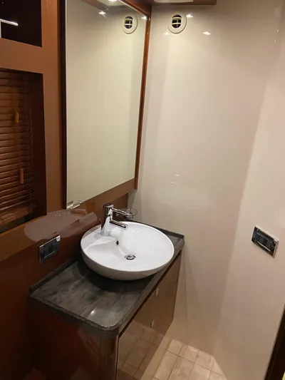 Yonder Star Yacht Photos Pics Luxurious bathroom interior of 2016 Sea Ray 510 Fly yacht with modern sink and mirror.